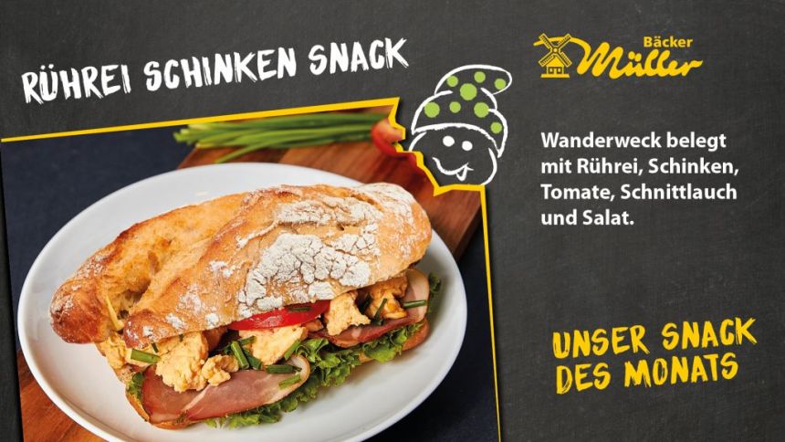 Bäcker Müller Aktionsschild, Unser Snack des Monats: Rührei-Schinken-Snack. Wanderweck belegt mit Rührei, Schinken, Tomate, Schnittlauch und Salat